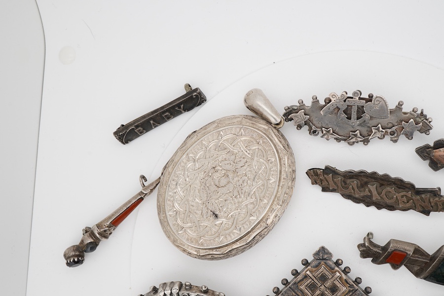Ten assorted late 19th/early 20th century silver brooches, including three with names, Baby, Millicent and Ellen, together with five other white metal brooches including Scottish hardstones, a coin set stick pin, hardsto